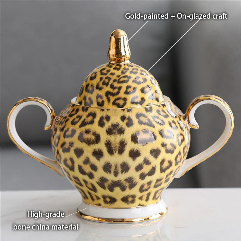 Wild Grace Collection: A sophisticated porcelain tea and coffee set featuring a bold leopard print, including a teapot, cups, sugar bowl, and creamer.