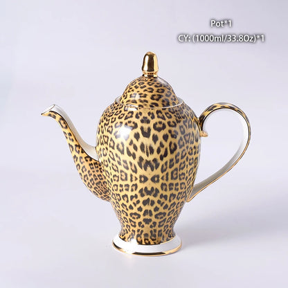 Wild Grace Collection: A sophisticated porcelain tea and coffee set featuring a bold leopard print, including a teapot, cups, sugar bowl, and creamer.